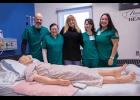Photo by James Mason FUTURE NURSES – The current cohort of nurses-to-be and their instructor get their picture taken with their favorite patient. From left are Daniel Hobbs, Veronica Verbridge, RN and instructor Wendy Smith, Vanessa Tahlhofer and Kallie King.