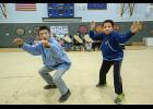 Photo by James Mason TELLER CULTURAL FESTIVAL— Shishmaref dancers Kenny Iyatunguk, left, and Gavin Nayokpuk entertain the crowd at last weekend’s Teller Cultural Festival. See story and photos on pages 8/9.